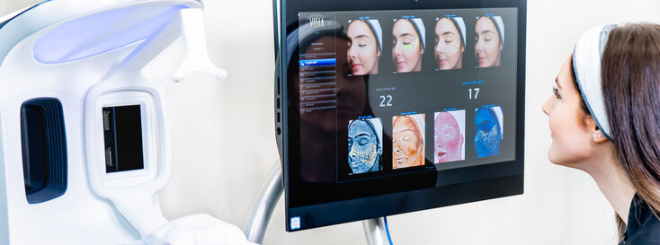 VISIA skin analysis in surrey showing camera machine and face views on screen with patient