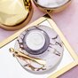 TNS Eye Repair Cream on dish with gold - flat lay product image