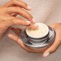 SkinMedica Dermal Repair Cream - hands with open lid reaching into night face cream