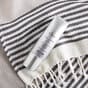 SkinMedica Total Defense + Repair face sunscreen on beach blanket - available in Canada