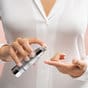 Vitamin C + E Complex by SkinMedica being pumped onto finger - product available in Canada