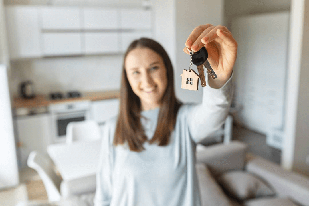 Lady with keys to newly rented condo