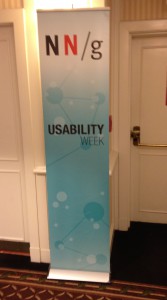 Nielsen Norman Group Usability Week banner in hallway