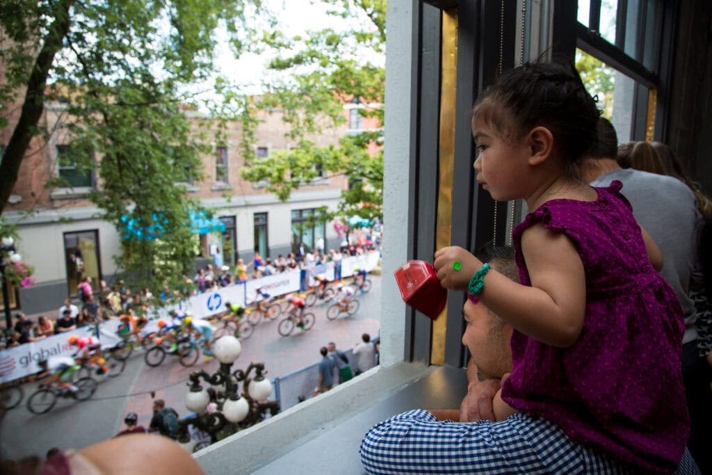 Photo of child looking out OXD Gastown office window