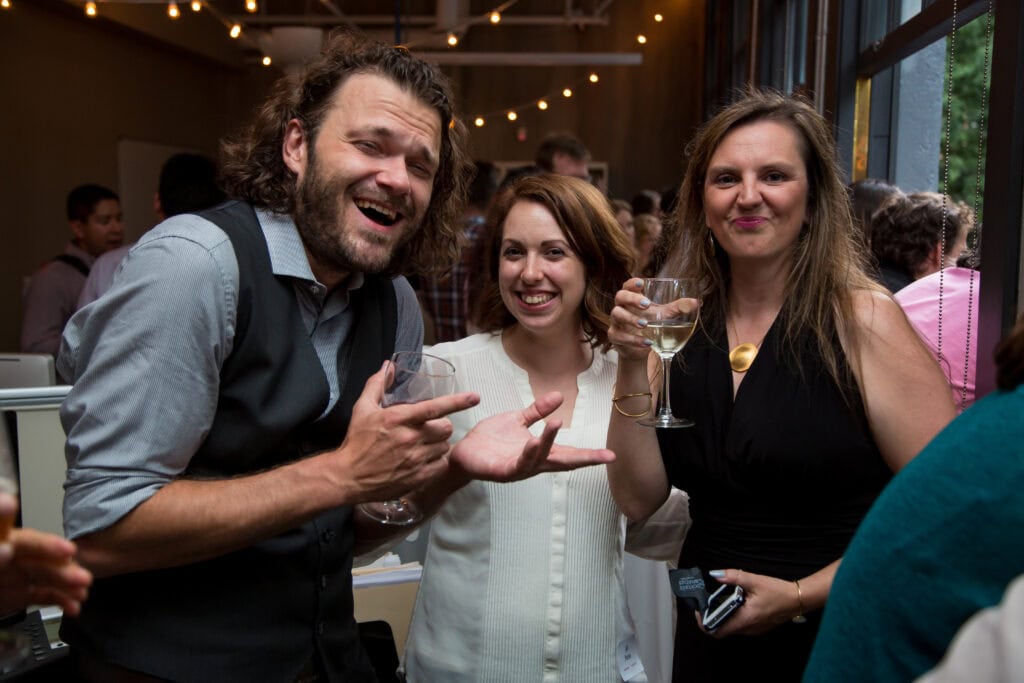 Photo of OXD staff Wil and his wife and another female laughing together