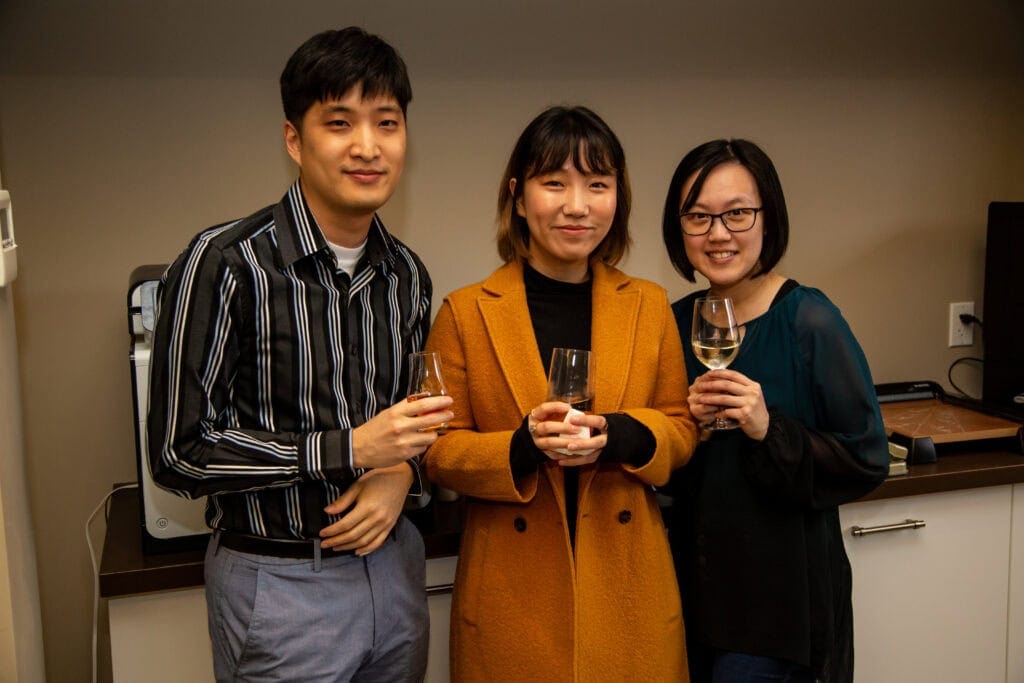 Photo of three people with drinks