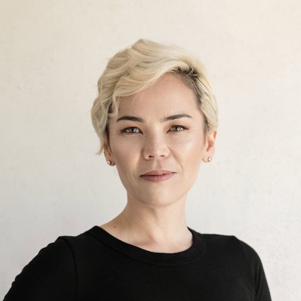 Headshot of Kat Holmes in colour