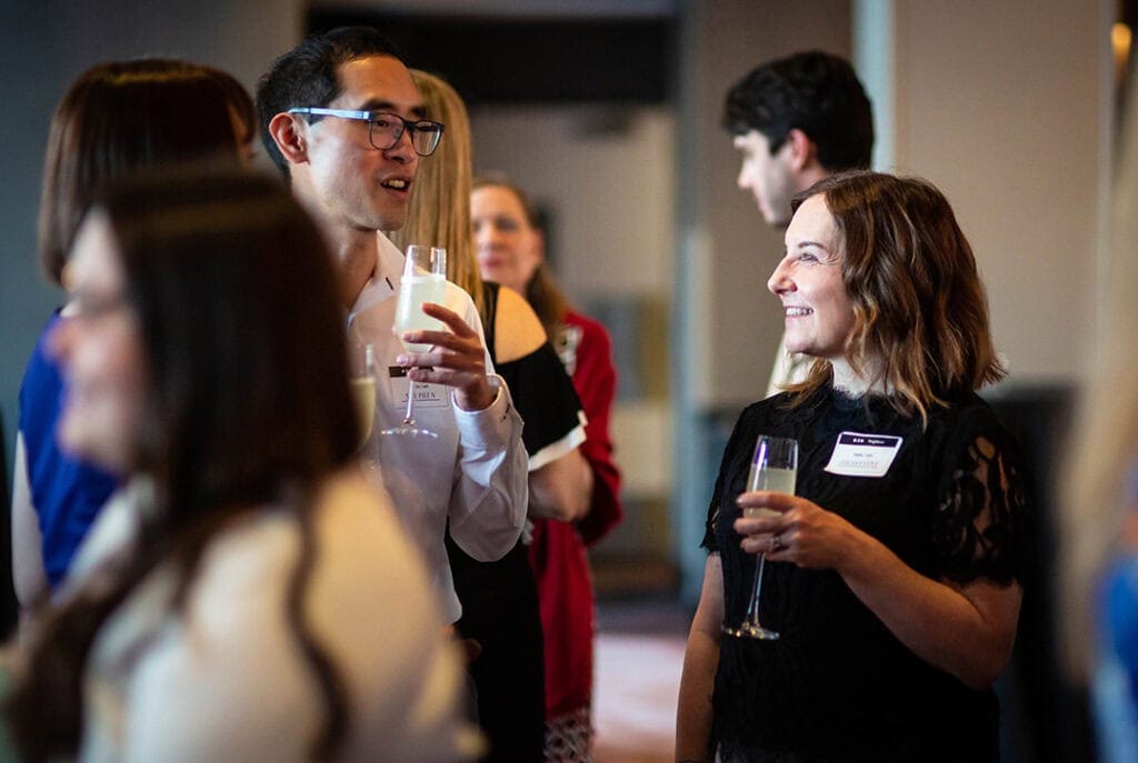 Photo of Jacqueline talking to other people