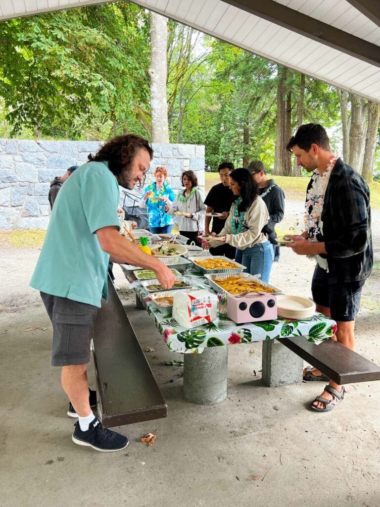 OXD and ThoughtFarmer staff getting food at a picnic table