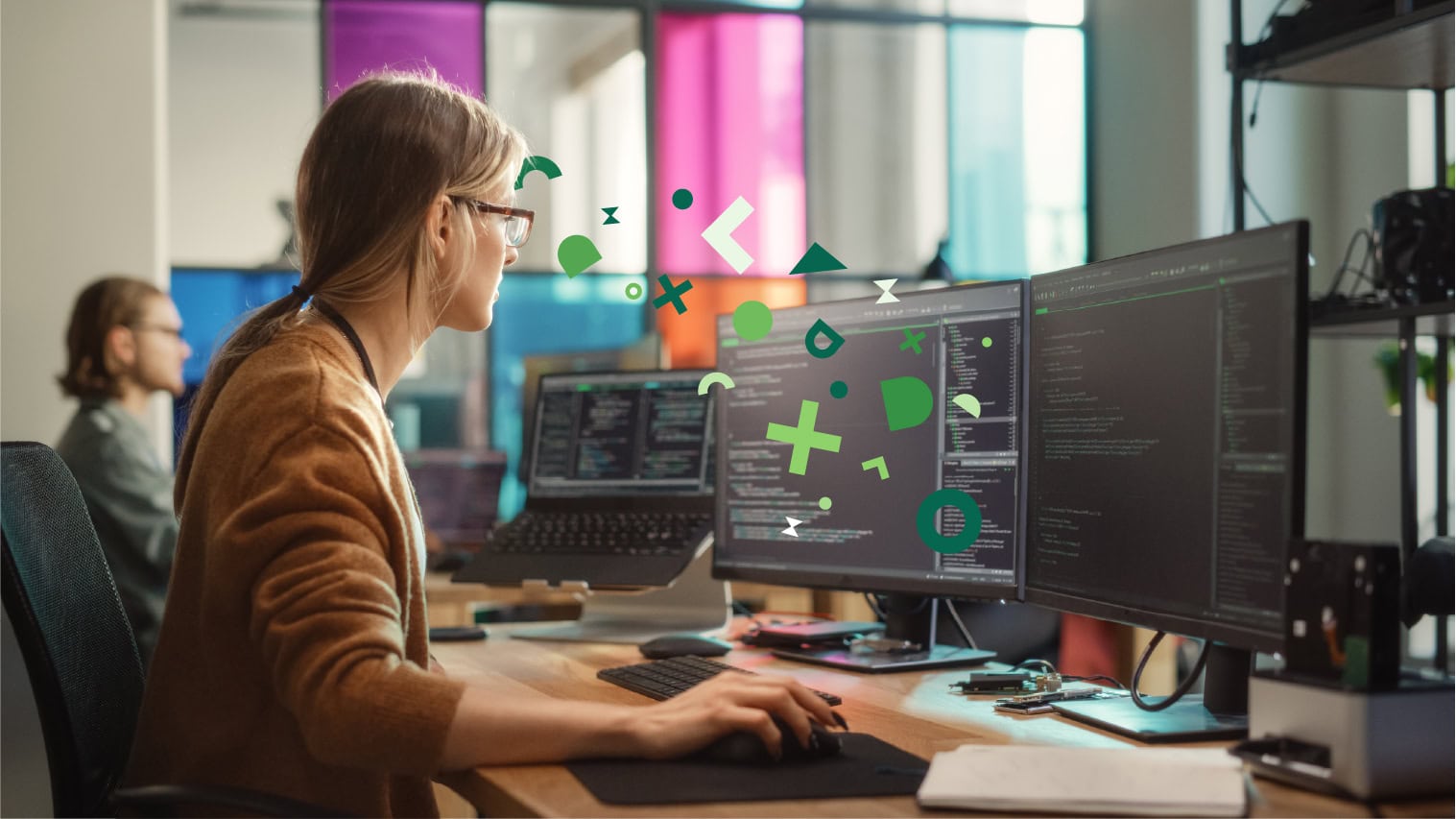 A software developer works at a dual-monitor setup with code on the screens, overlaid with abstract shapes flowing between her brain and the screen, representing the knowledge transfer and absorption.