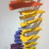 Paper planes simultaneosly hitting the wall with geometrical order, Sigalot Daniele