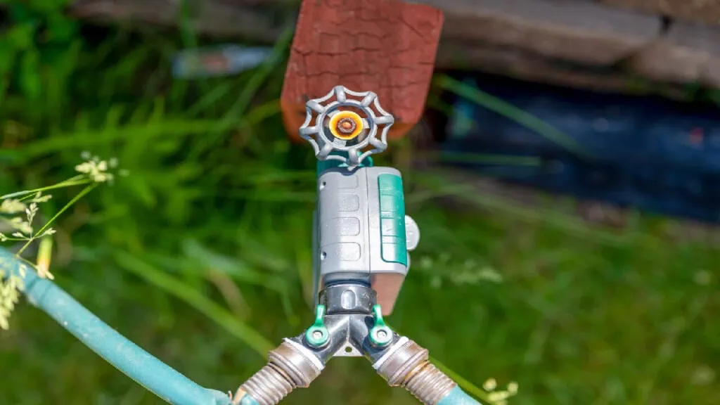 timer in garden with hose