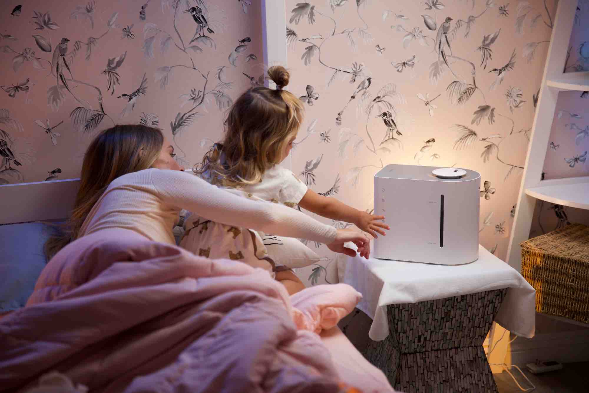 mom and daughter touching a product 