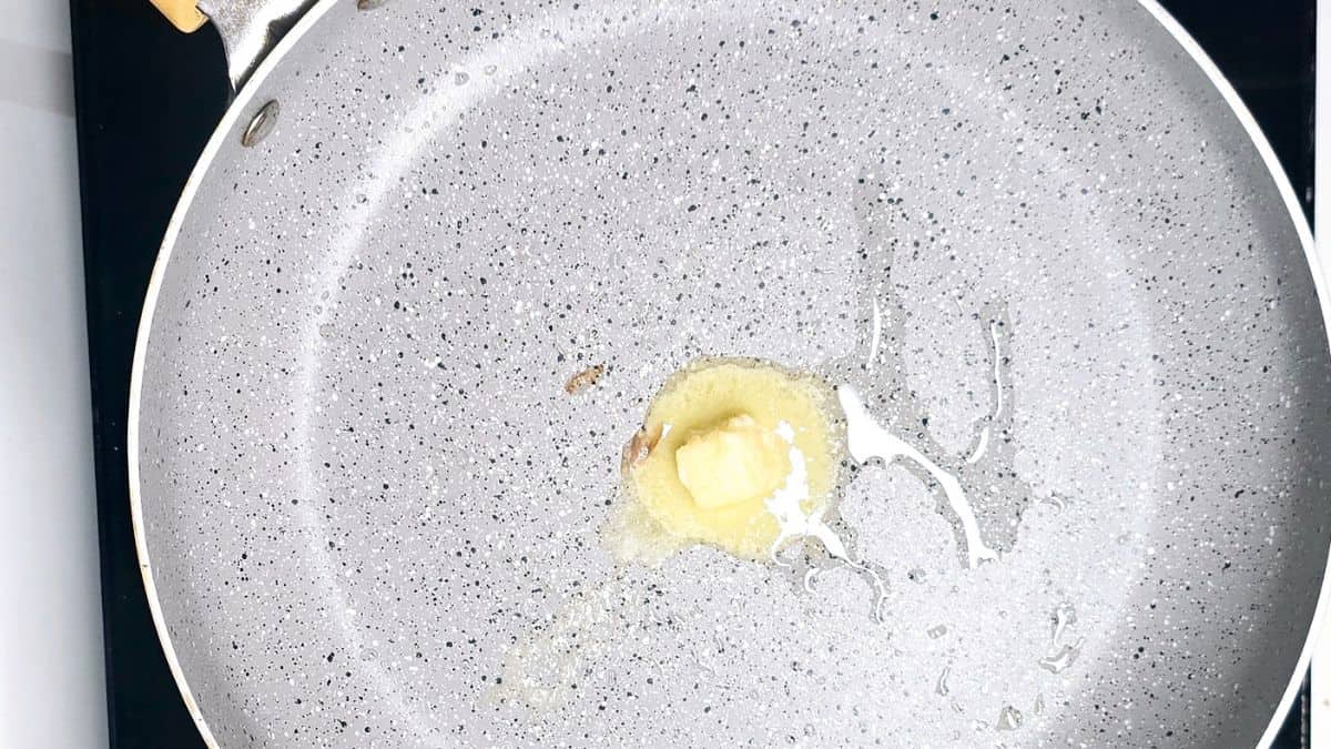 Garlic Bread Recipe using Pan Step 7: Heat the butter using non-stick pan