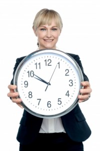 woman holding a clock